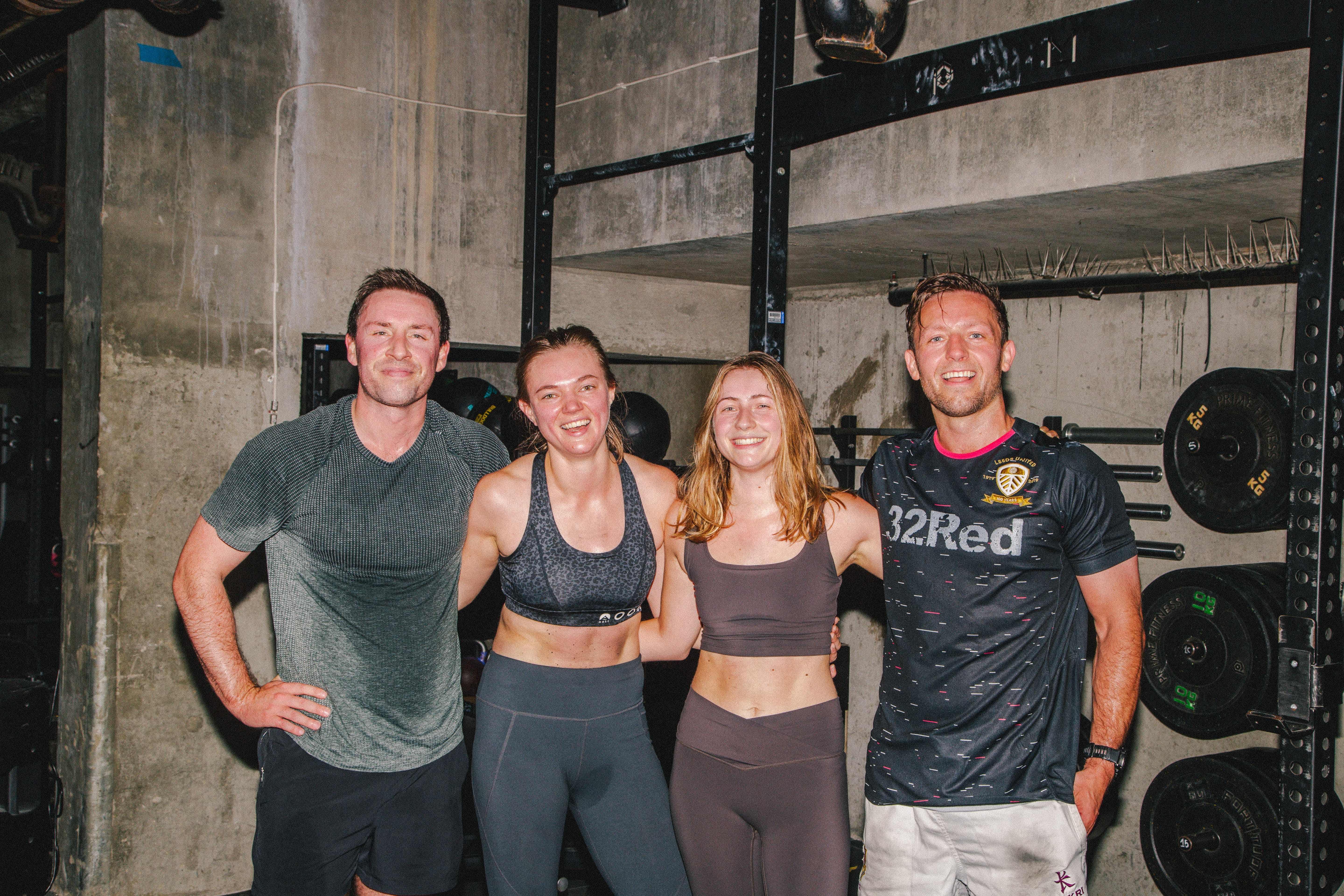 A group of people pose for a group shot.
