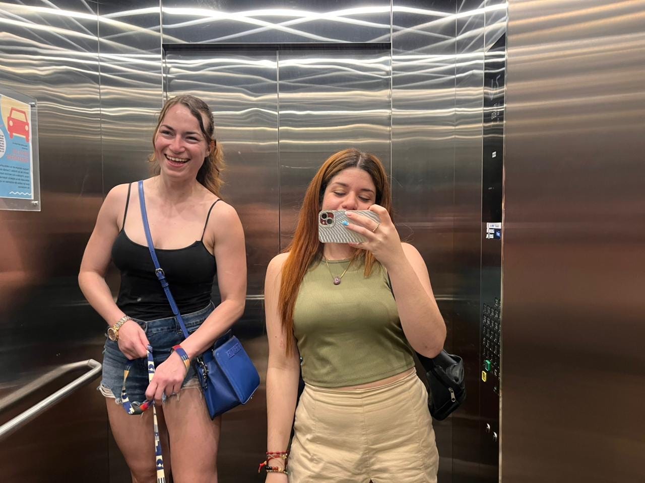The author in an elevator with her friend Jenni.