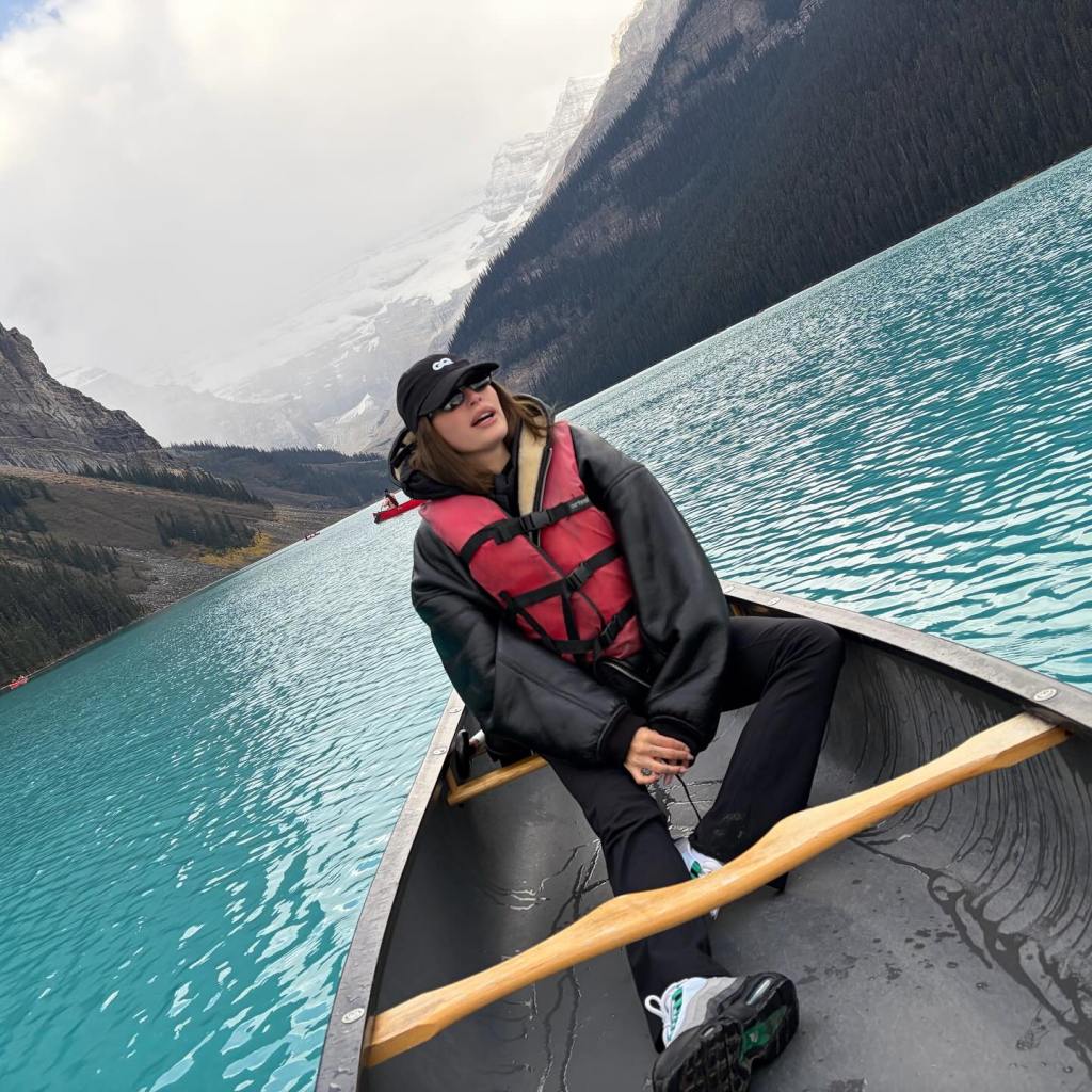 That’s not a painted backdrop — it’s Canada’s Lake Louise, where Hailey Bieber took in the sights.
