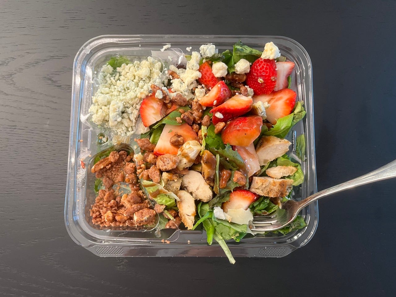 Salad with fruit and nuts in container