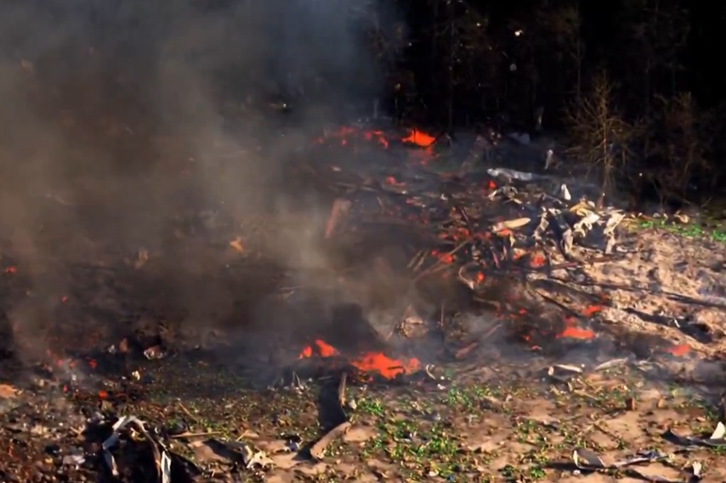 Smoke rising from red-hot debris after an explosion at an explosives manufacturer in Tennessee.