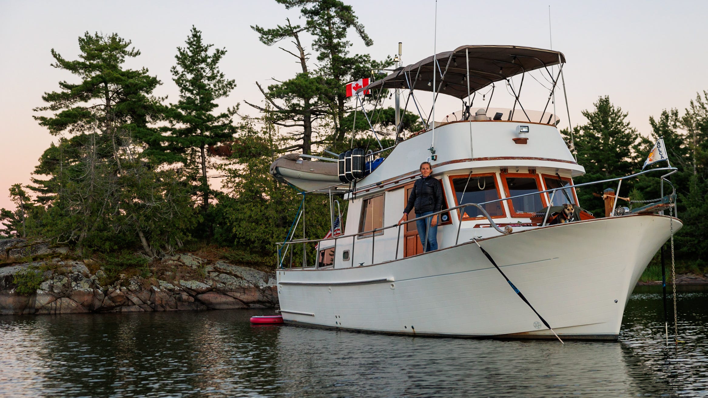 A woman posing on a boat.