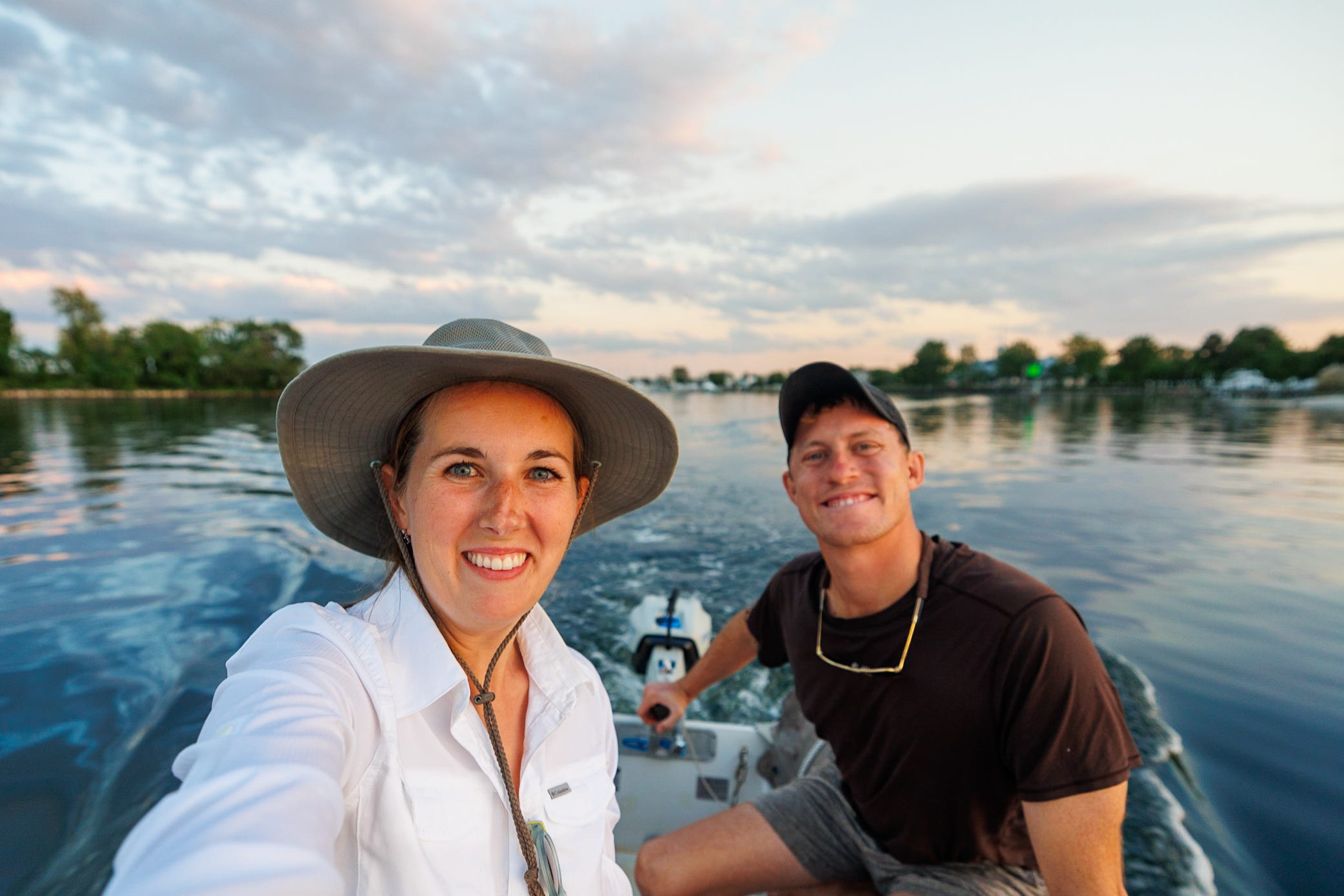 Two people taking a selfie on a dinghy.