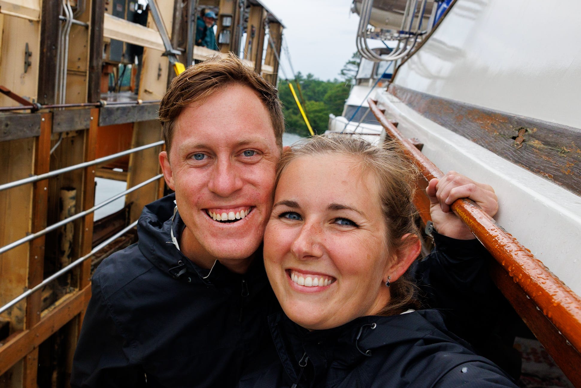 A couple taking a selfie on a boat.