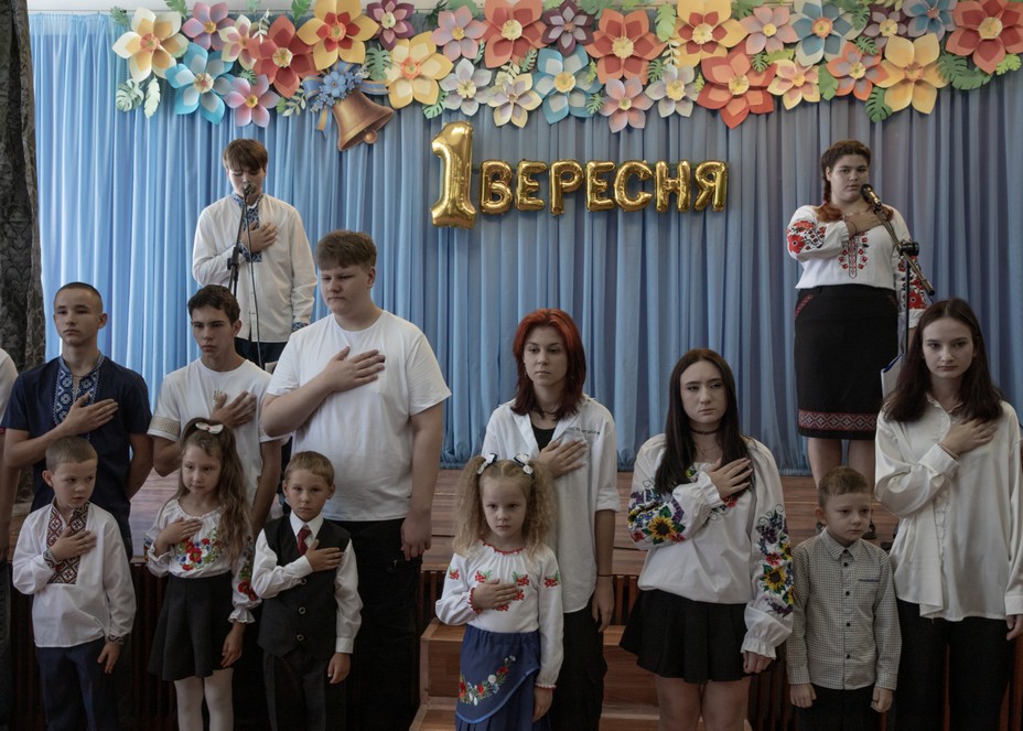 Picture of young students during an opening of the school year in the village of Savyntsi.
