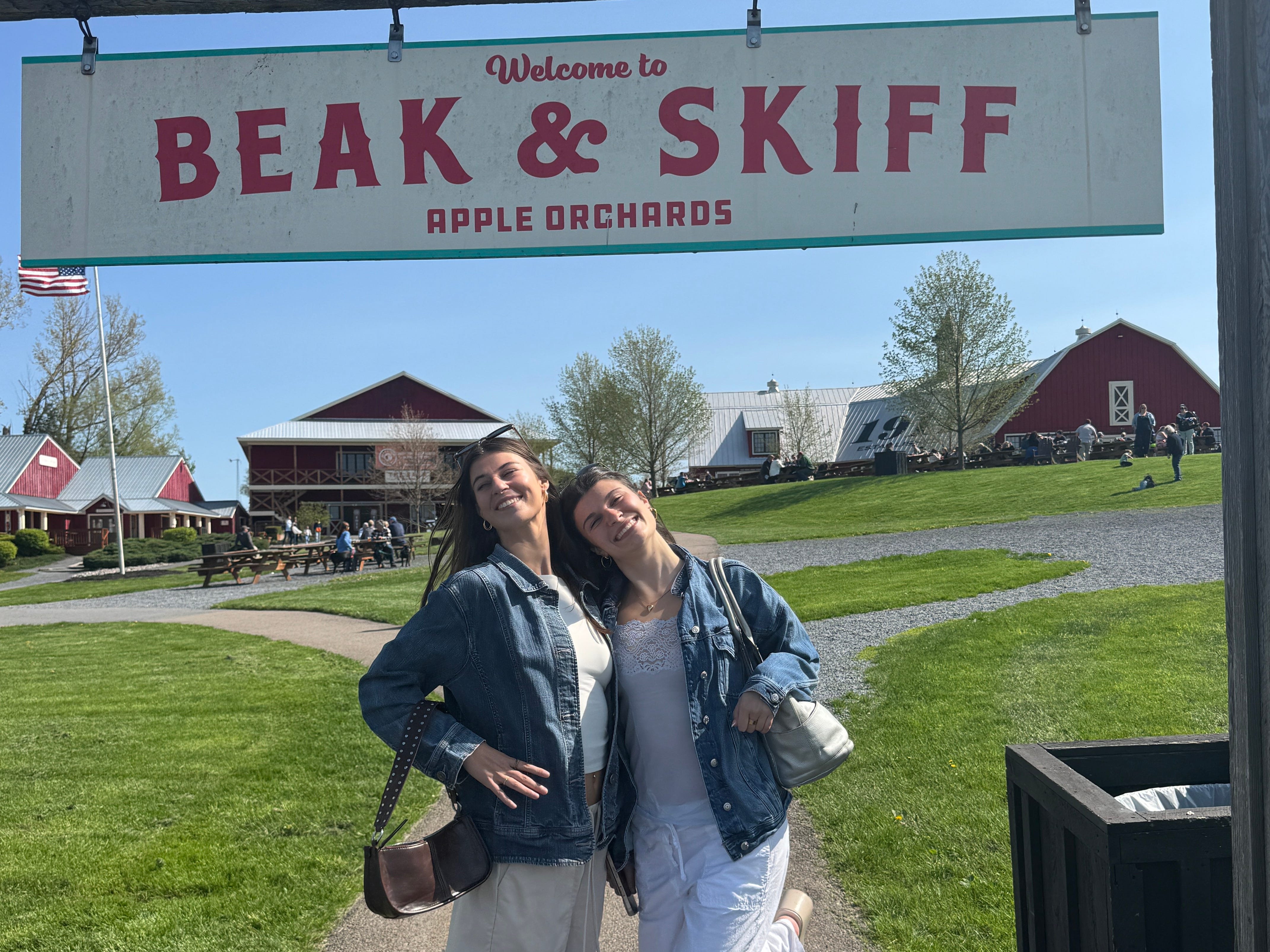 The author and her sister posing at Beak & Skiff Apple Orchards.