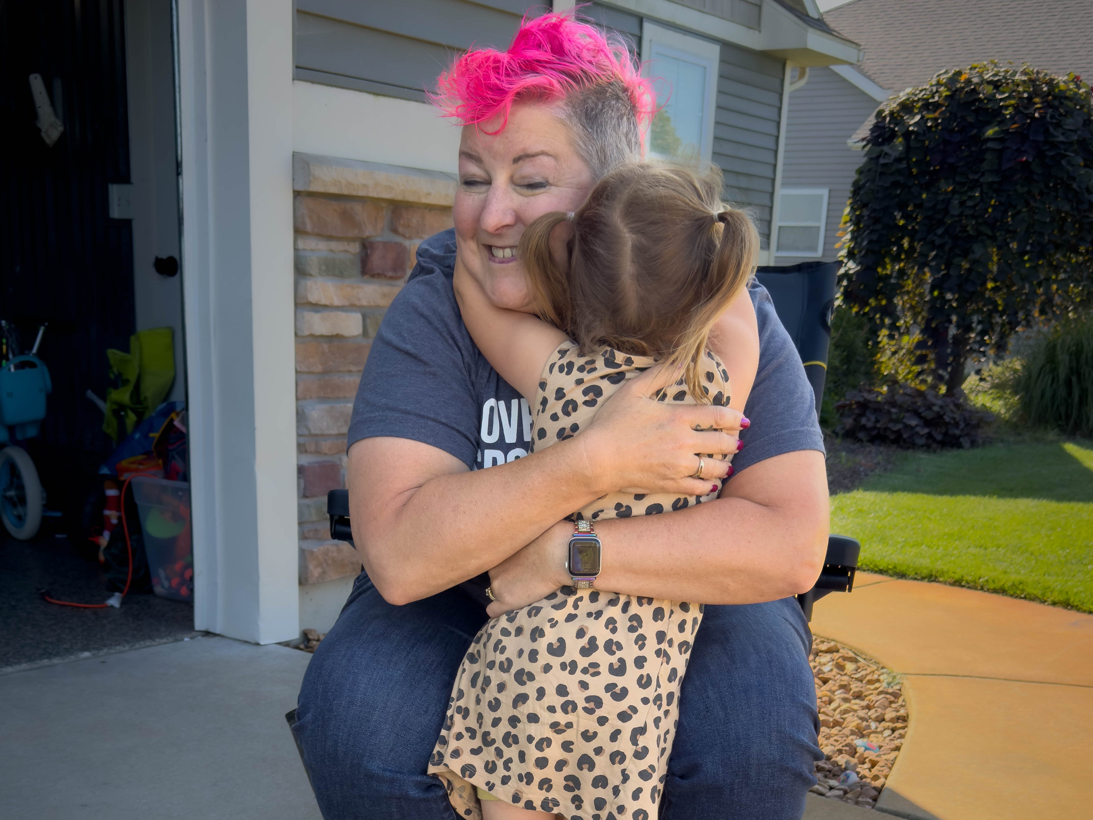 Grandma hugging granddaughter