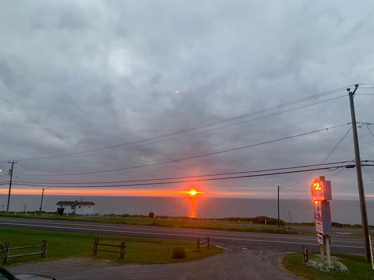Sunset over side of road