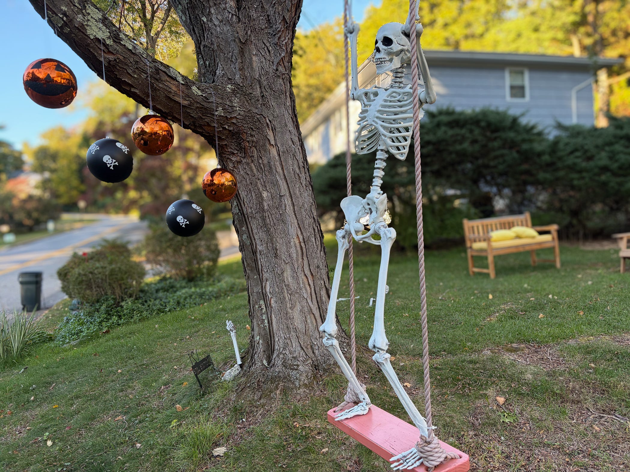 Some Halloween decorations in a front yard.