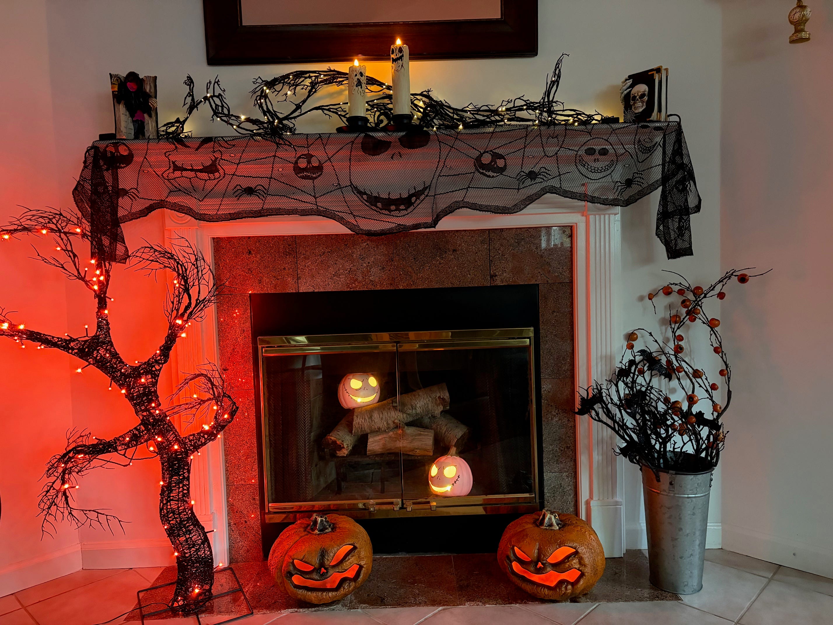 A fireplace adorned with Halloween decorations