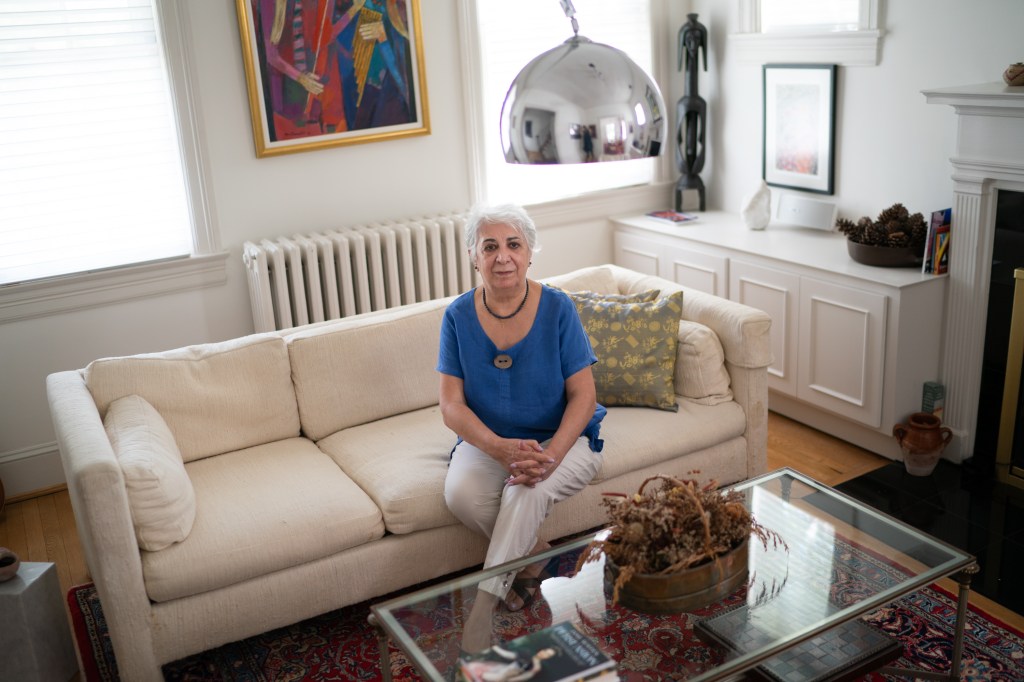 Josefa Ippolito-Shepherd sitting on a couch in her living room.