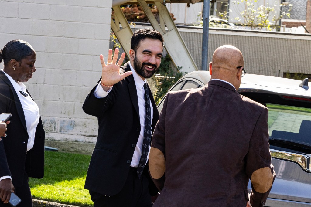 Mayoral candidate Zohran Mamdani waves to supporters.