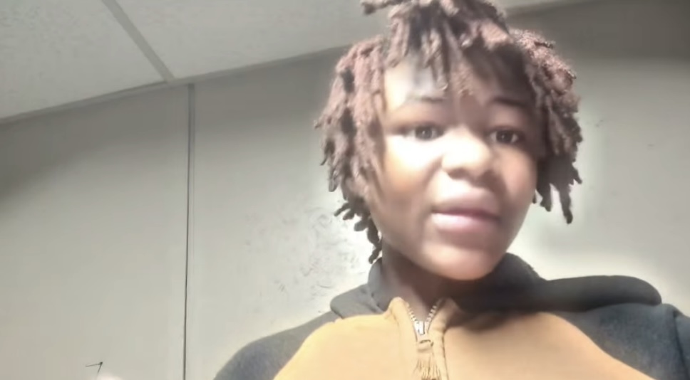 D’Uwan Morgan, a teen with brown dreadlocks, wearing a brown and black zip-up hoodie.