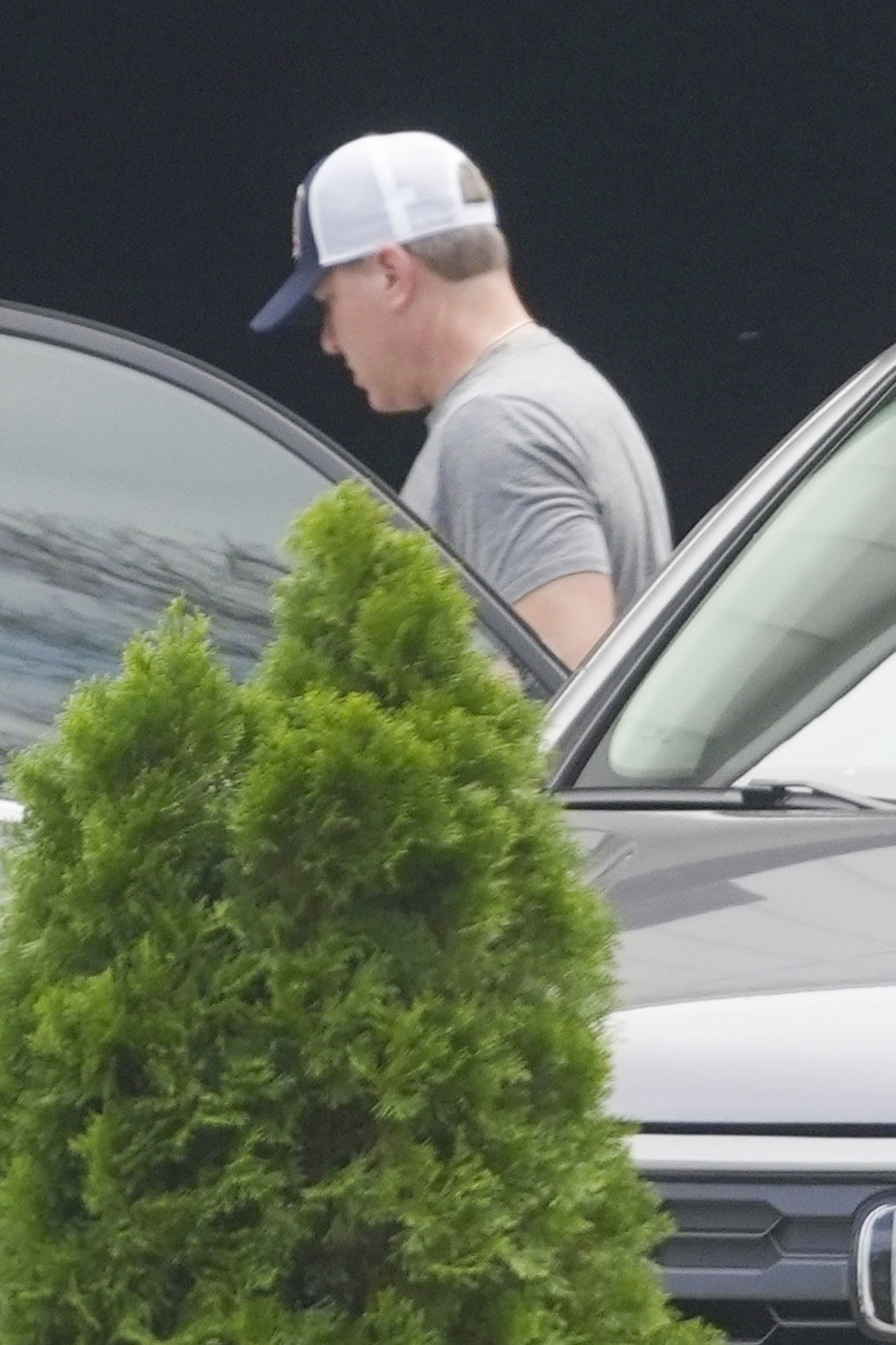 Kyle Mowitz in a gray T-shirt and trucker hat.