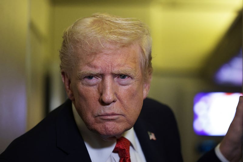 U.S. President Donald Trump speaks to members of the press on October 19, 2025 aboard Air Force One. The President is returning to Washington, DC, after spending his weekend at Mar-a-Lago resort in Palm Beach, Florida.