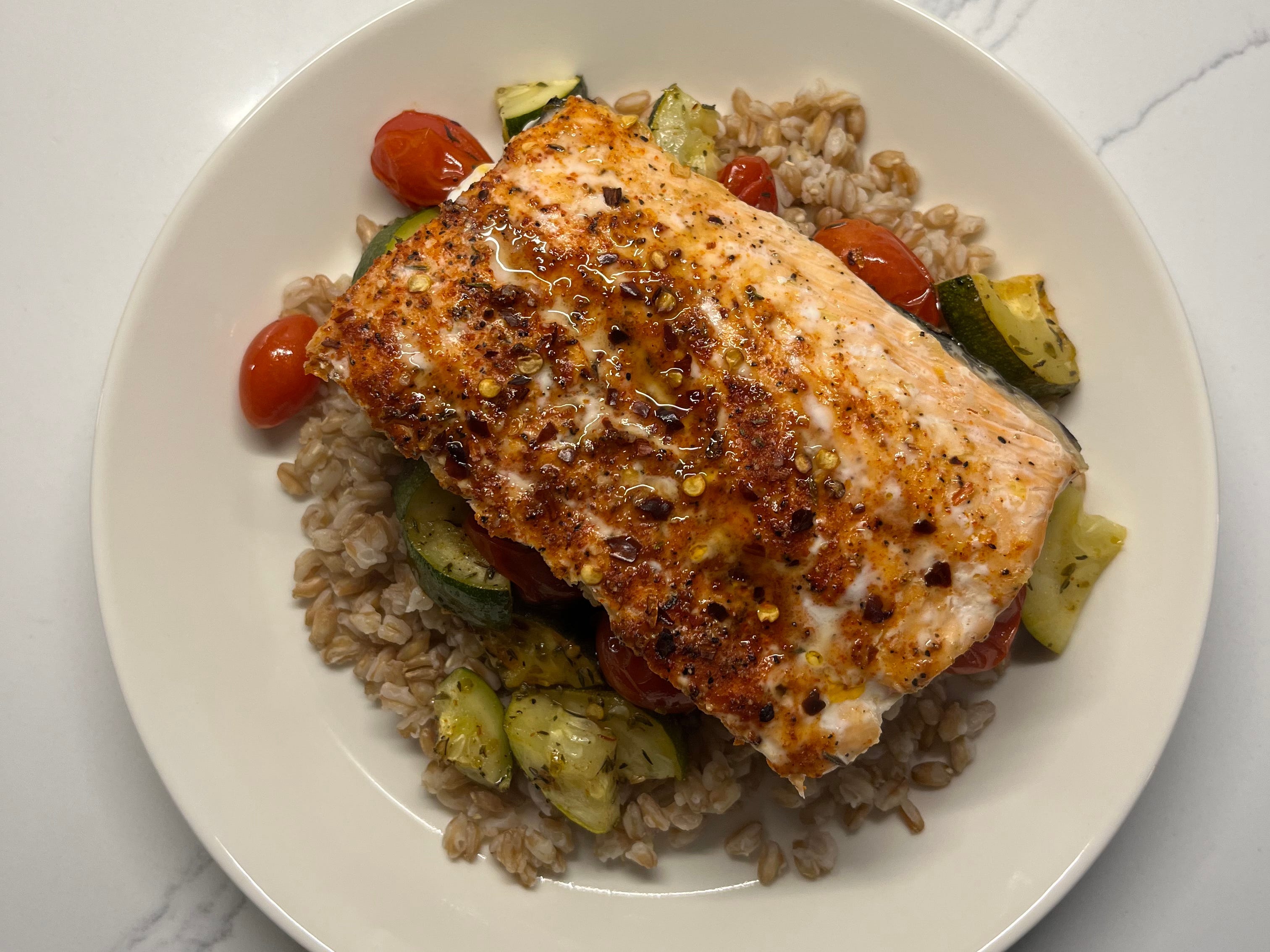 Salmon with vegetables and farro