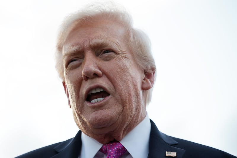 WEST PALM BEACH, FLORIDA - OCTOBER 17: U. S. President Donald Trump speaks to members of the press after he landed at West Palm Beach International Airport on October 17, 2025 in West Palm Beach, Florida. President Trump is spending his weekend at Mar-a-Lago in Palm Beach, Florida. (Photo by Alex Wong/Getty Images)