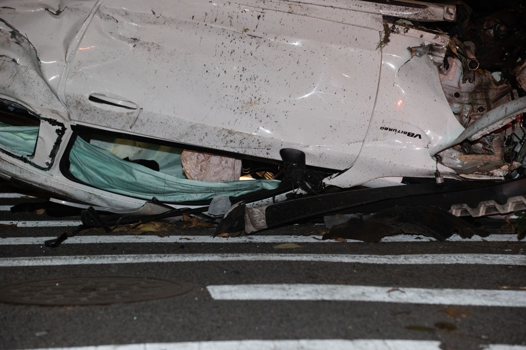 Police officers investigate a fatal accident on the West bound Belt Parkway in Brooklyn at E 7th St. in Brooklyn, Monday, Oct. 20, 2025.  
