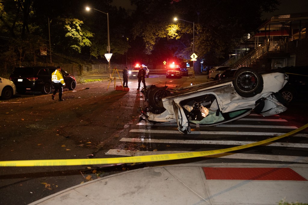 Police officers investigate a fatal accident on the West bound Belt Parkway in Brooklyn at E 7th St. in Brooklyn, Monday, Oct. 20, 2025.