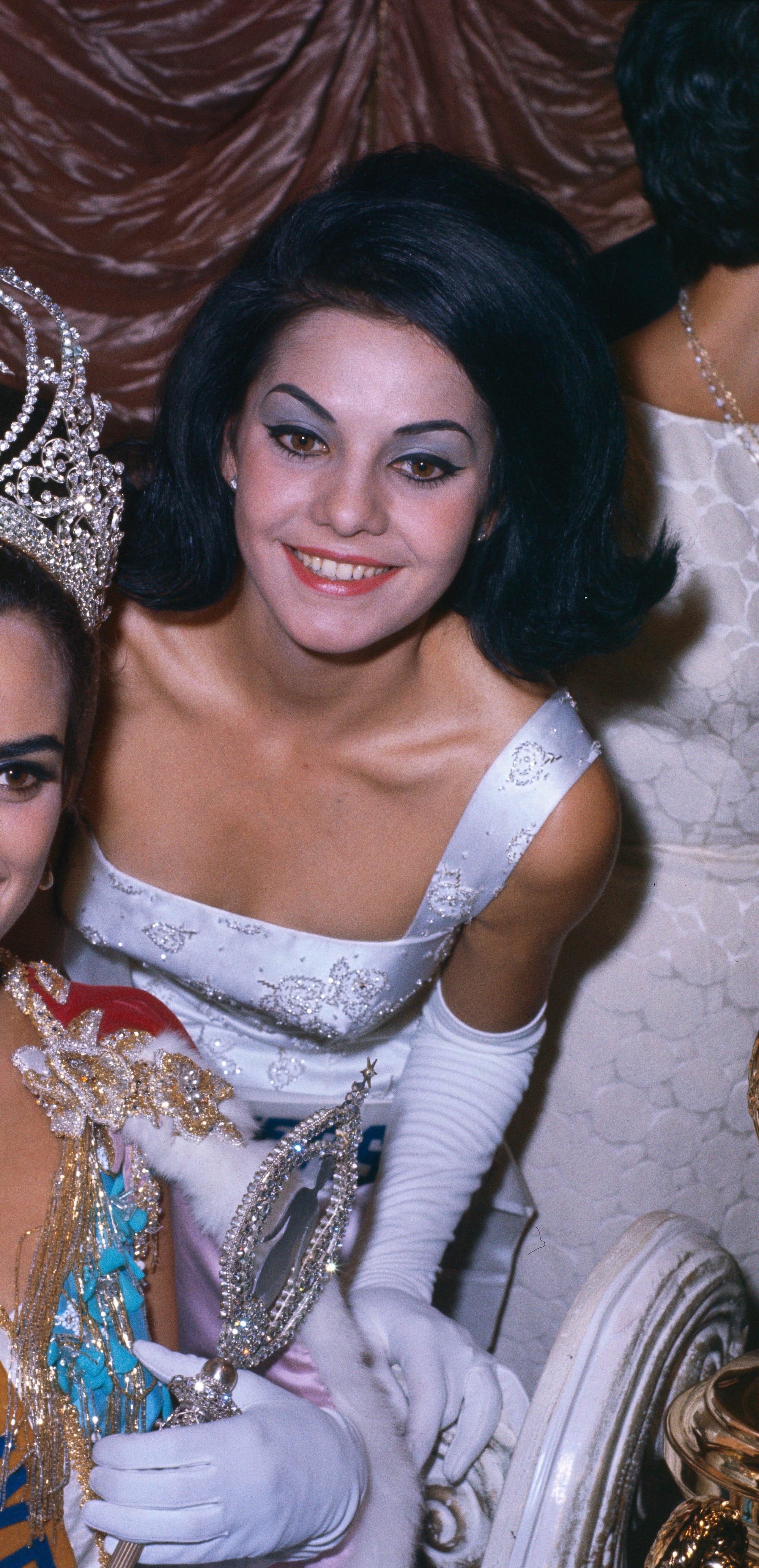 Miss USA 1961 Sharon Brown smiles for a photo.