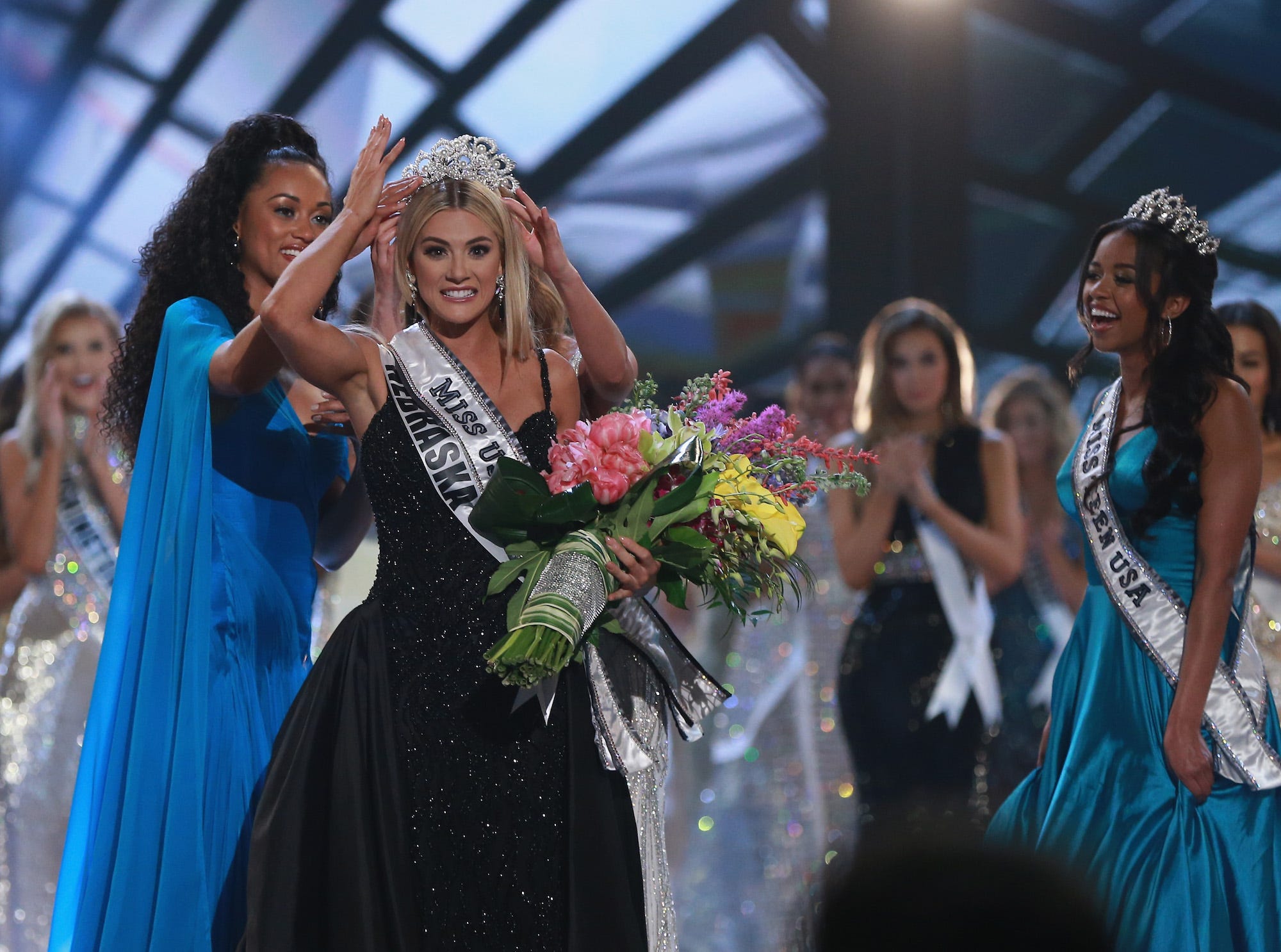Miss Nebraska Sarah Rose Summers is crowned by Miss USA 2017 Kara McCullough, Miss Universe 2017 Demi Leigh Nel Peters and Miss Teen USA 2018 Hailey Colborn after winning the 2018 Miss USA Competition.