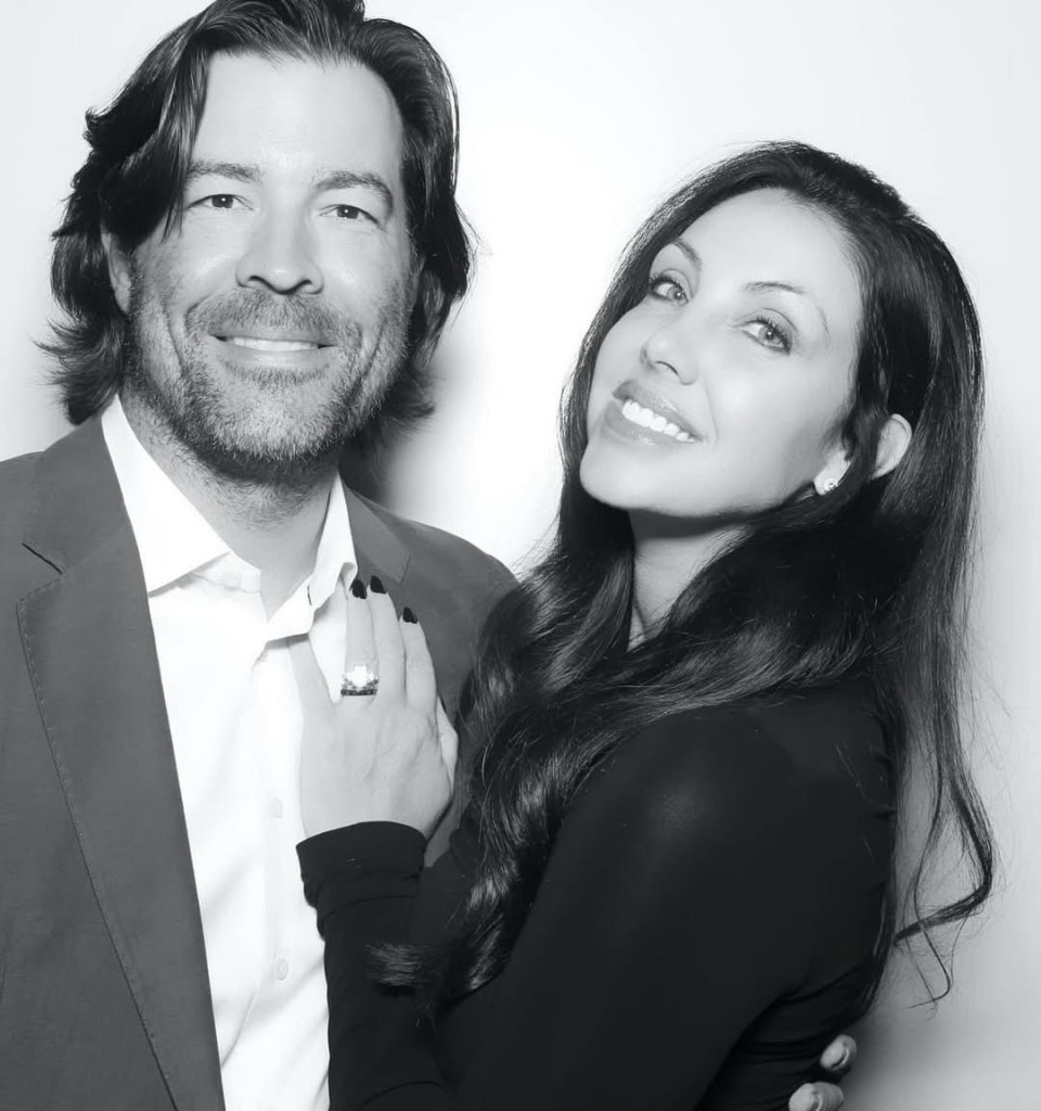 Black and white photo of Jennifer Powers and DJ Steve Powers embracing.
