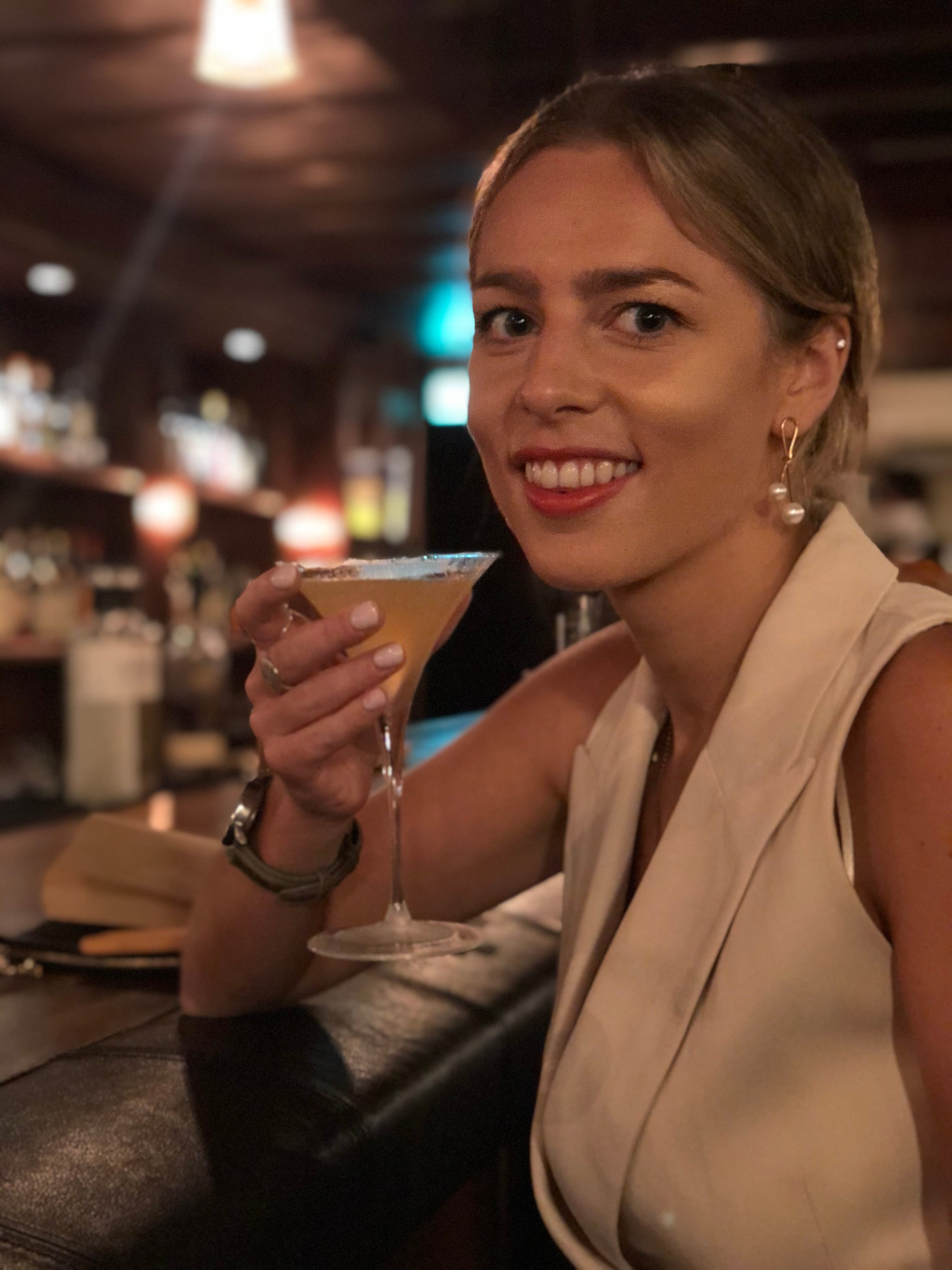 The author poses with a drink.
