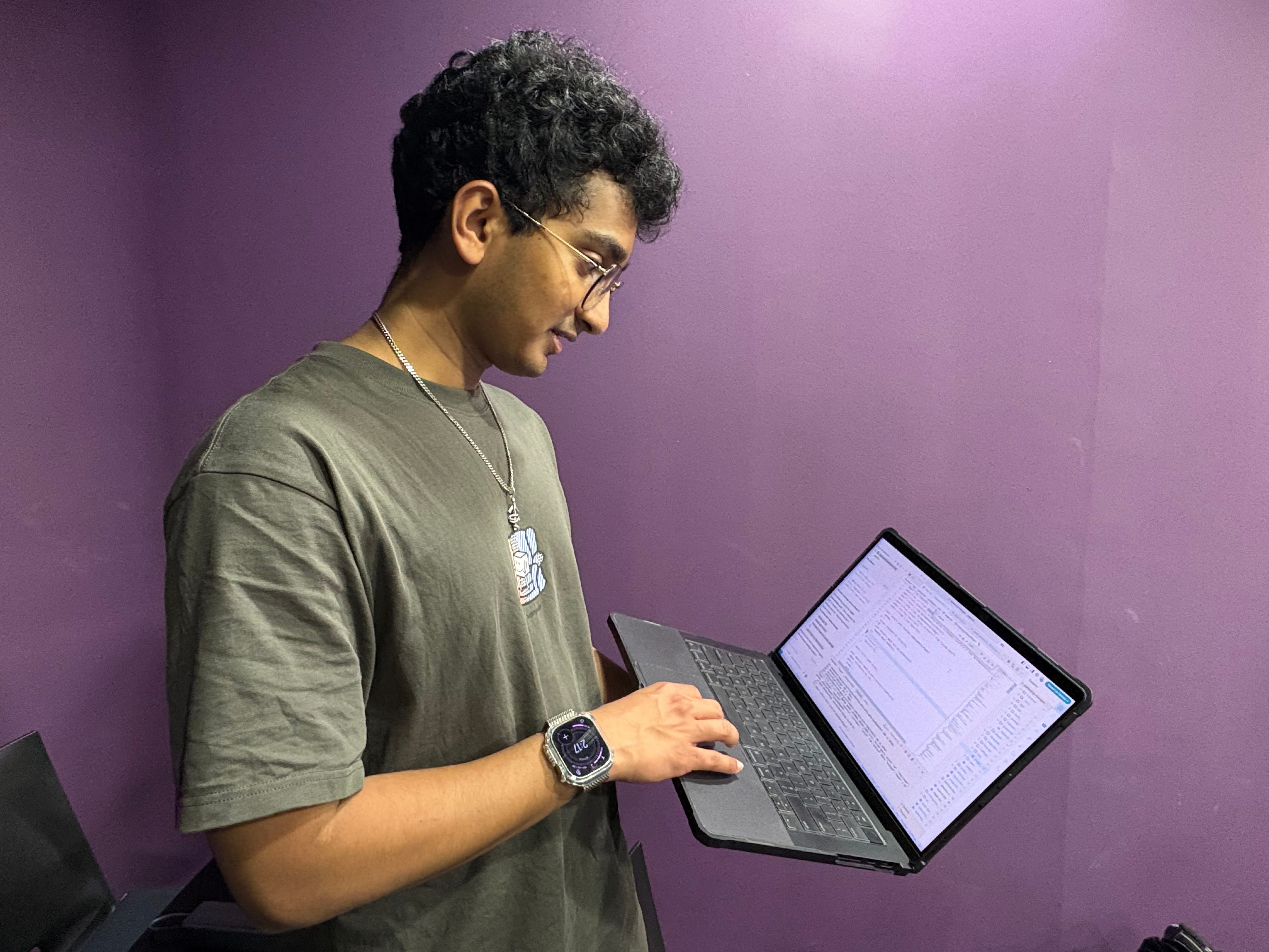 A boy showing his vibe coded website