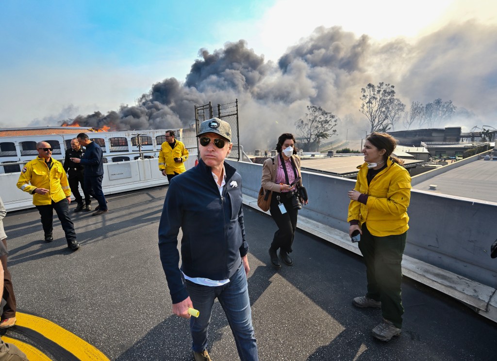 California Governor Gavin Newsom surveys fire damage in Pacific Palisades.