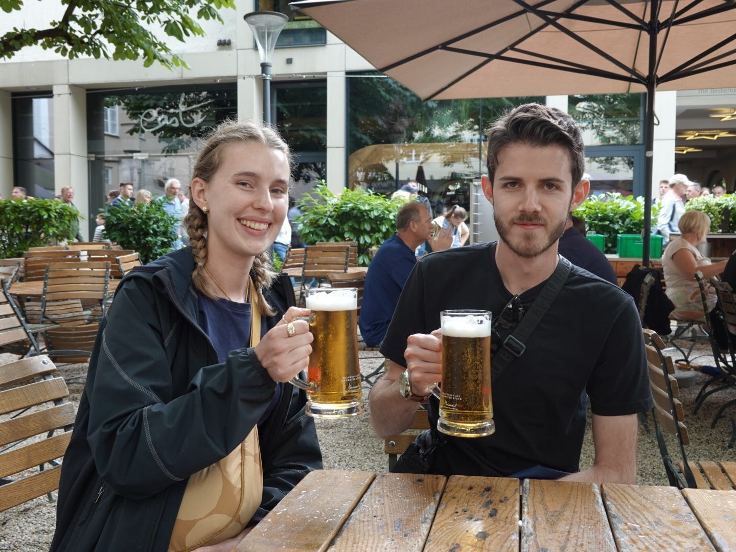 The author and her boyfriend posing with pints of beer in Salzburg, Austria.