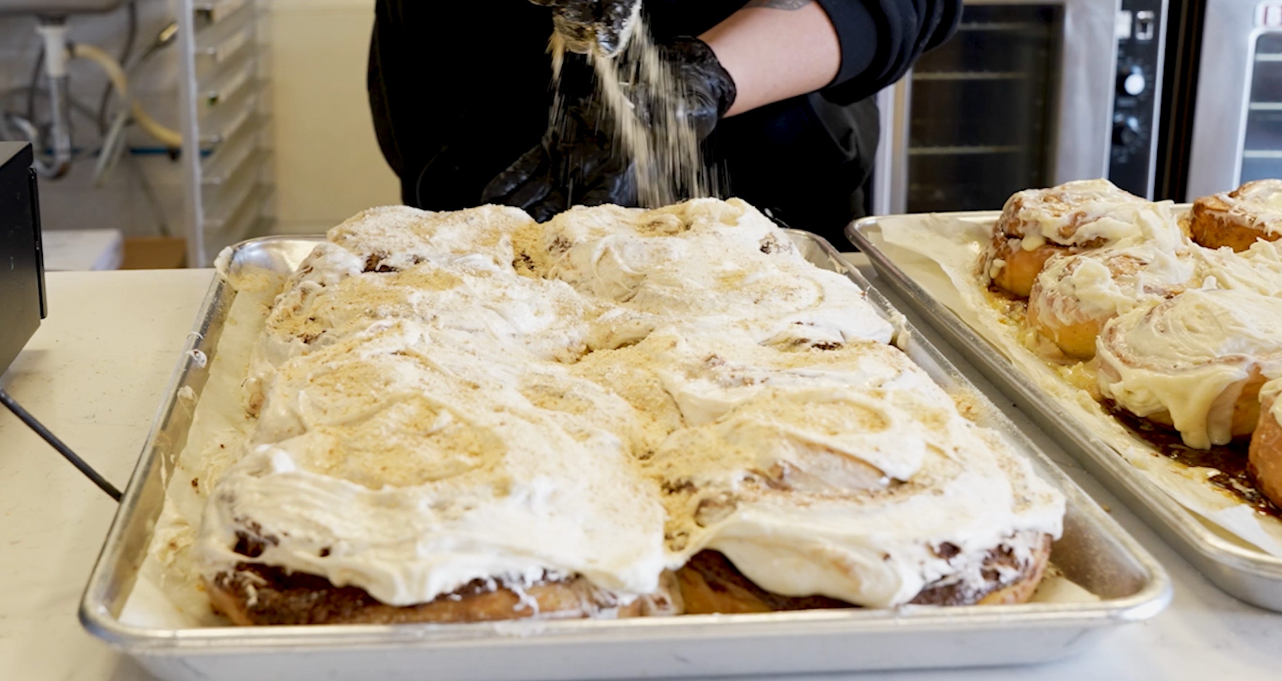 Cinnamon buns on a rack.