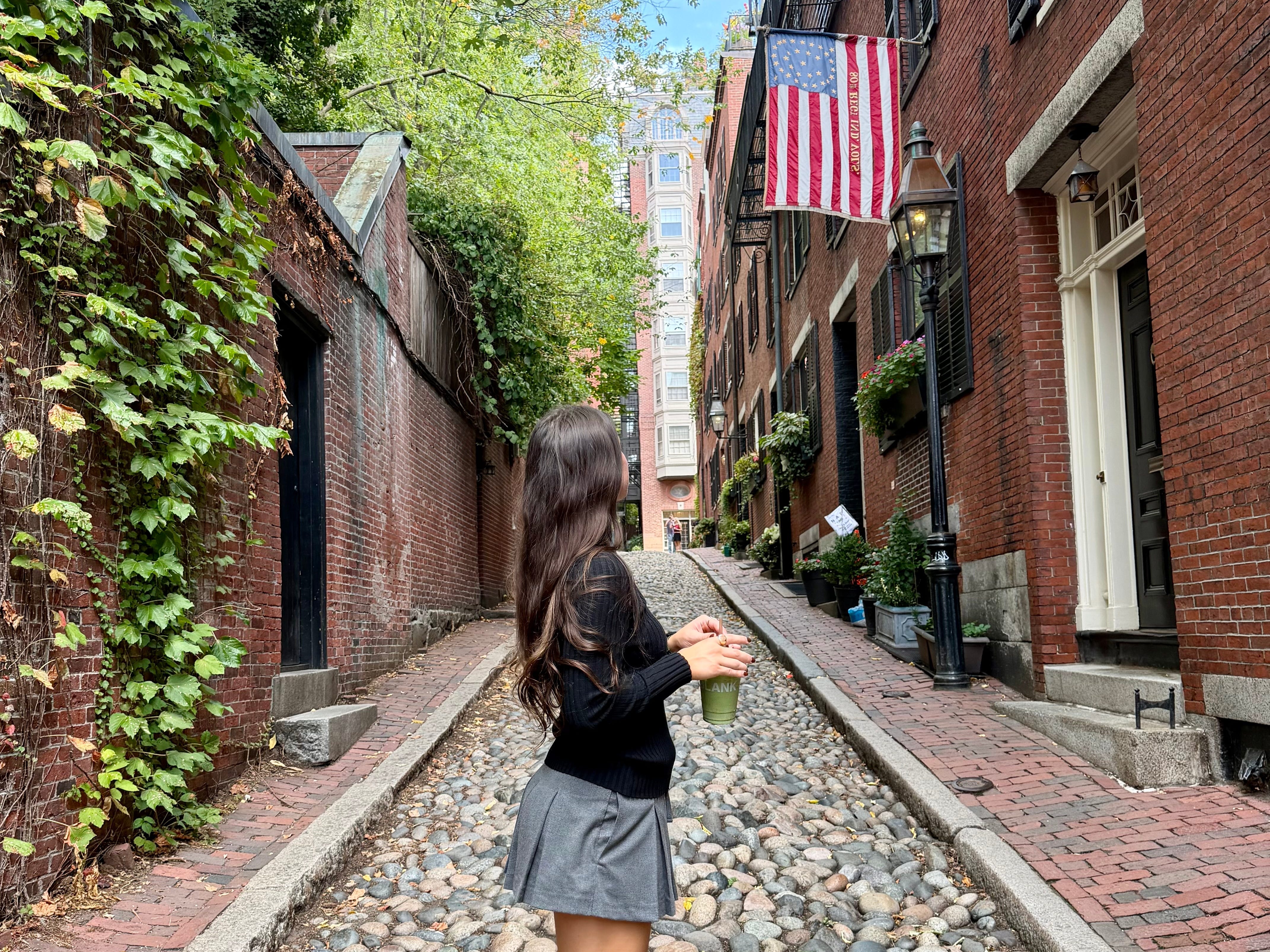 Amanda looking down Acorn Street in Boston.