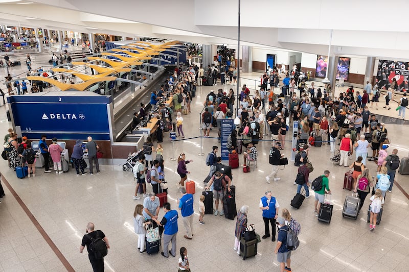 ATLANTA, GEORGIA - JULY 22: Delta Airlines passengers line up for agent assistance at Hartsfield-Jackson Atlanta International Airport on July 22, 2024 in Atlanta, Georgia. Delta Airlines cancelled over 700 flights on Monday due to the Crowdstrike software update, making up more than half of the flight cancellations in the U.S. (Photo by Jessica McGowan/Getty Images)