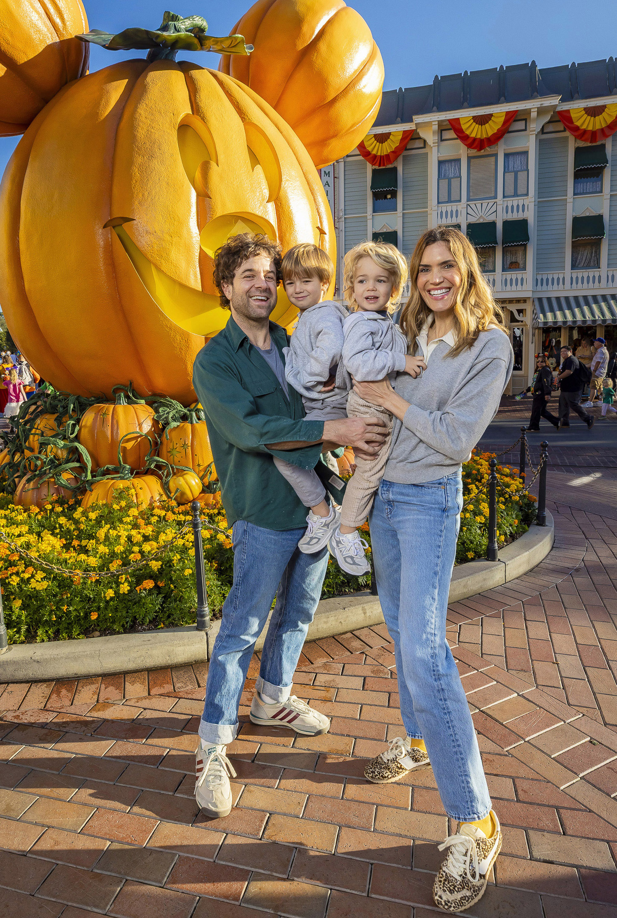 Mandy Moore and Taylor Goldsmith take their kids to Disneyland to celebrate Halloween.