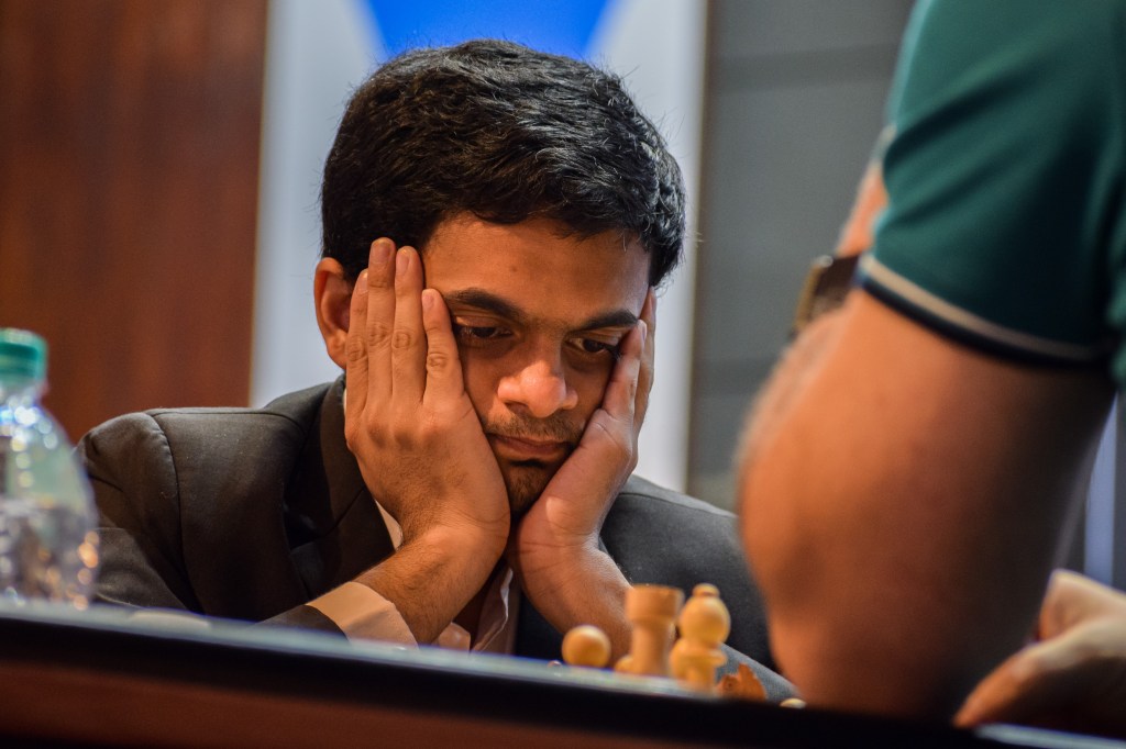 Nihal Sarin (left) of India ponders his next move against Shakhriyar Mamedyarov (right) of Azerbaijan during their rapid chess match.