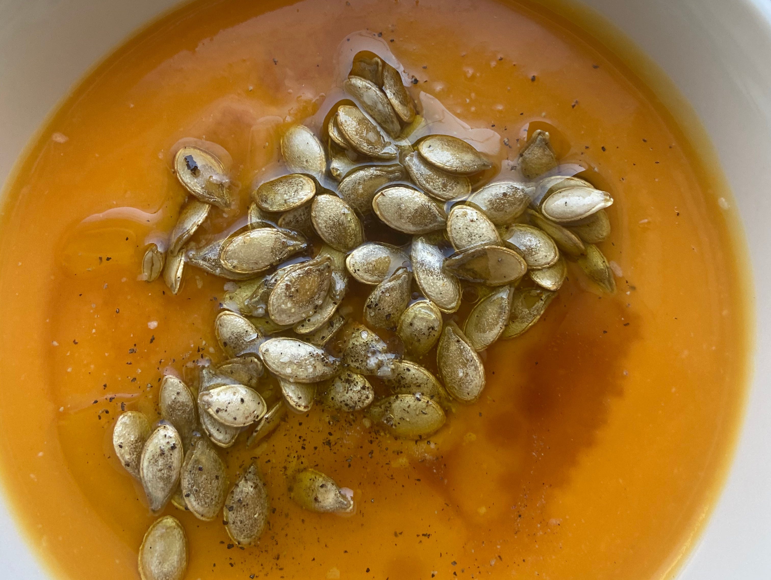 Butternut-squash soup with a pumpkin seed and oil garnish
