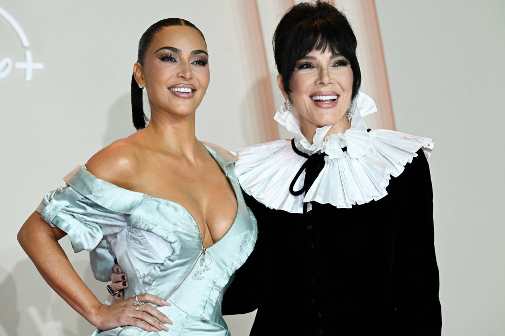 Kim Kardashian and Kris Jenner posing at the 