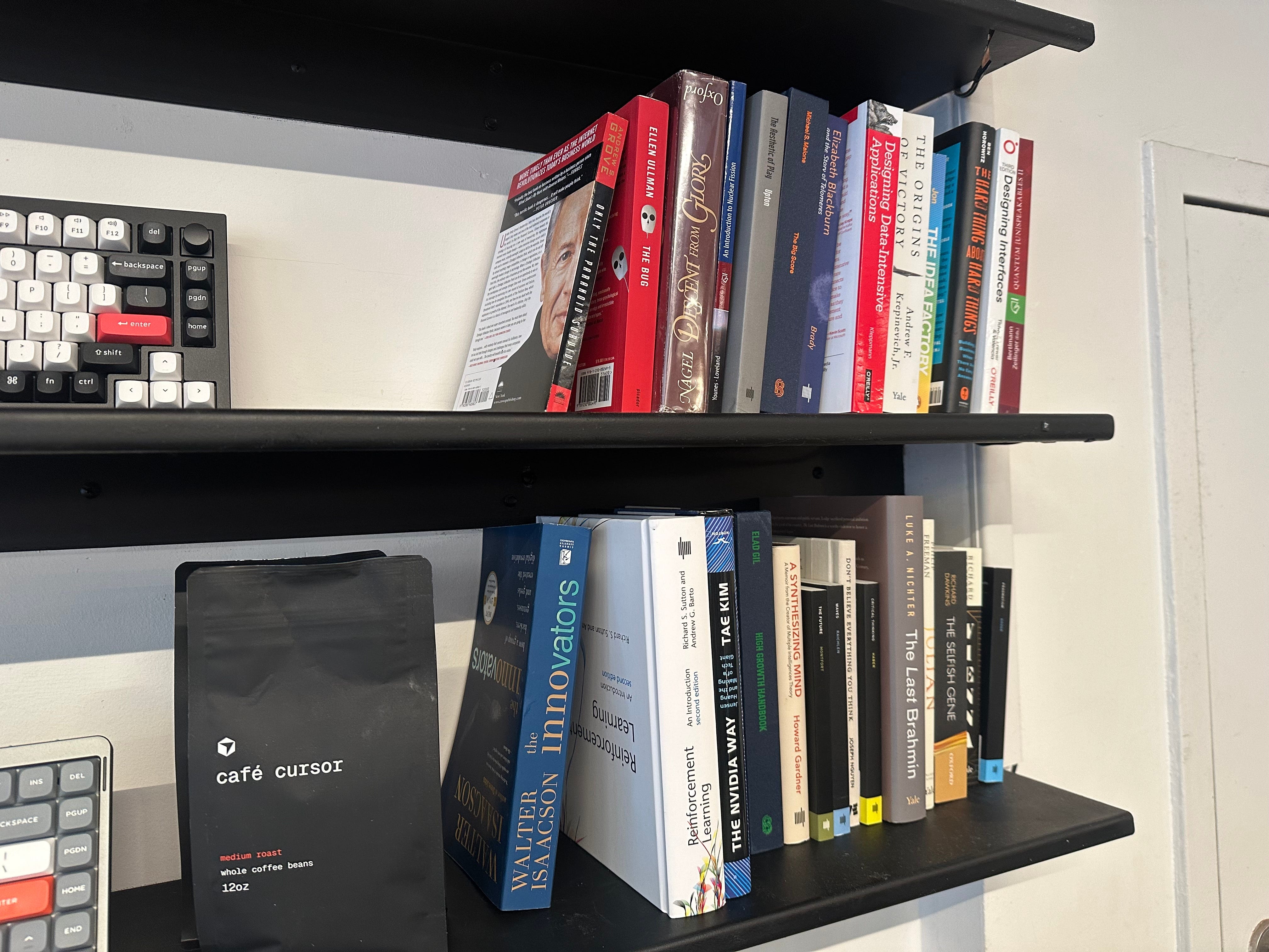The bookshelf at Cafe Cursor is pictured.
