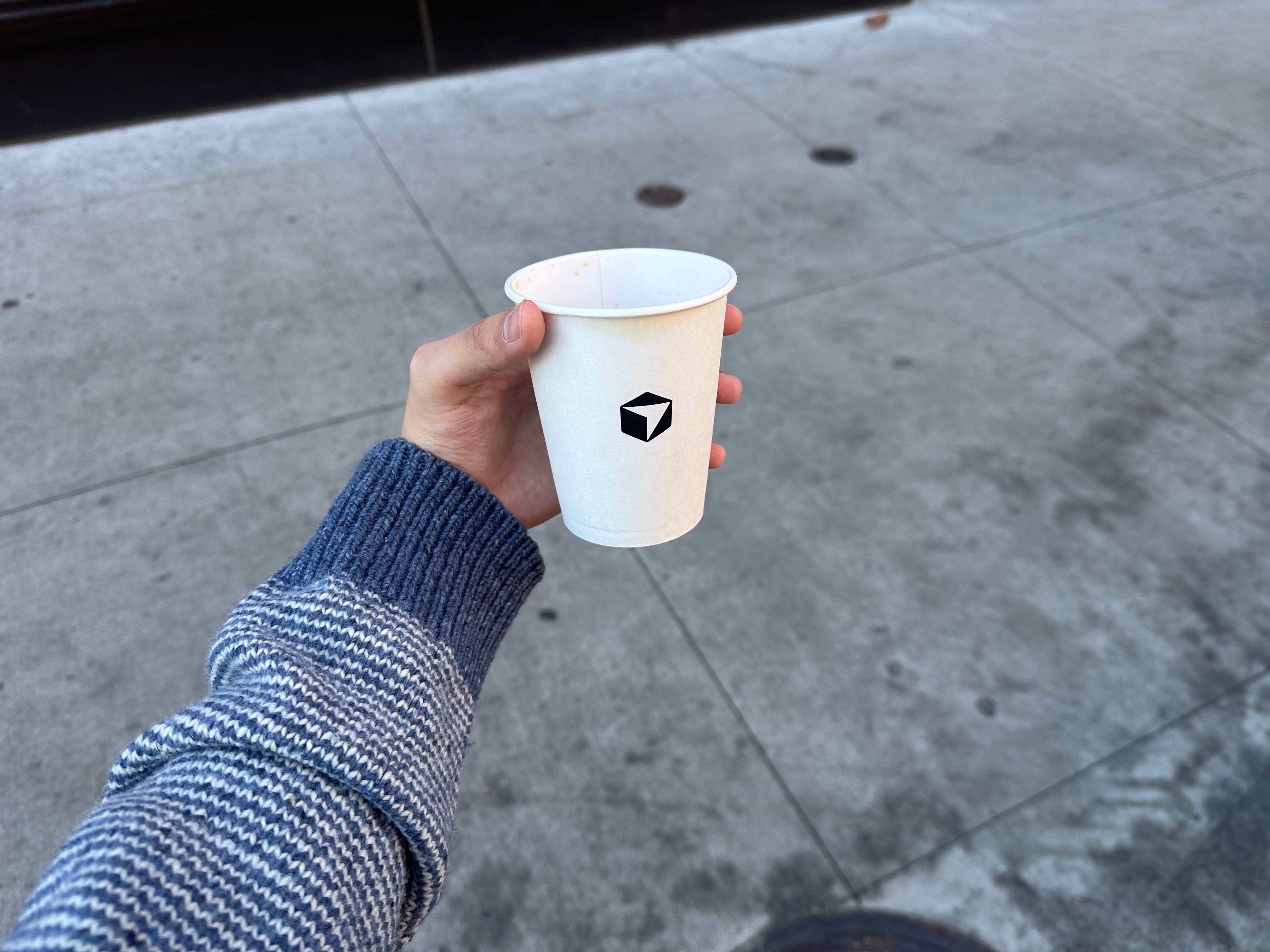 The Cursor coffee cup is pictured.
