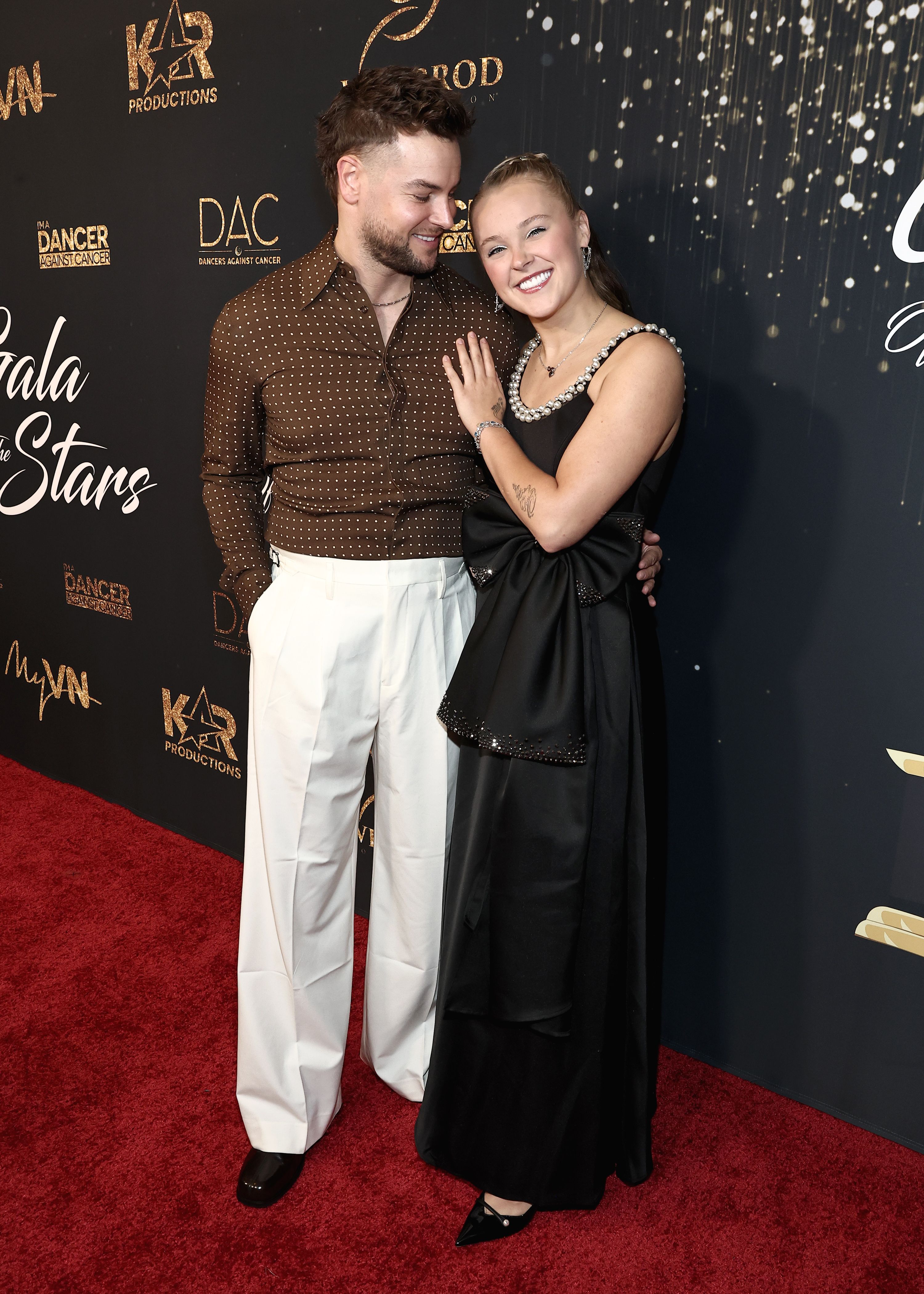 Chris Hughes and JoJo Siwa on the red carpet at the Dancers Against Cancer's 2025 Gala of the Stars.