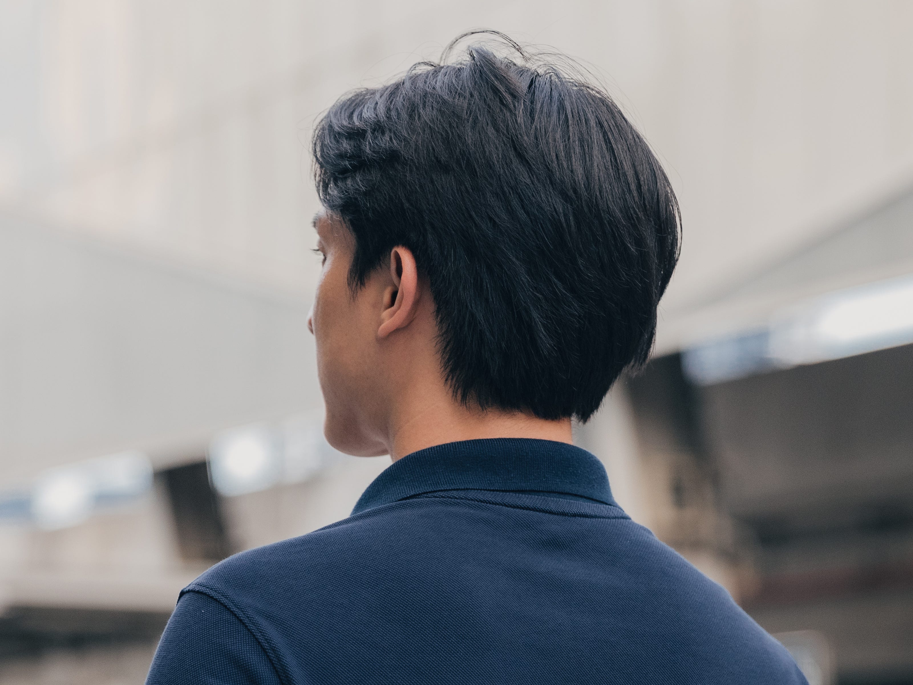 A man with slicked-back hair.