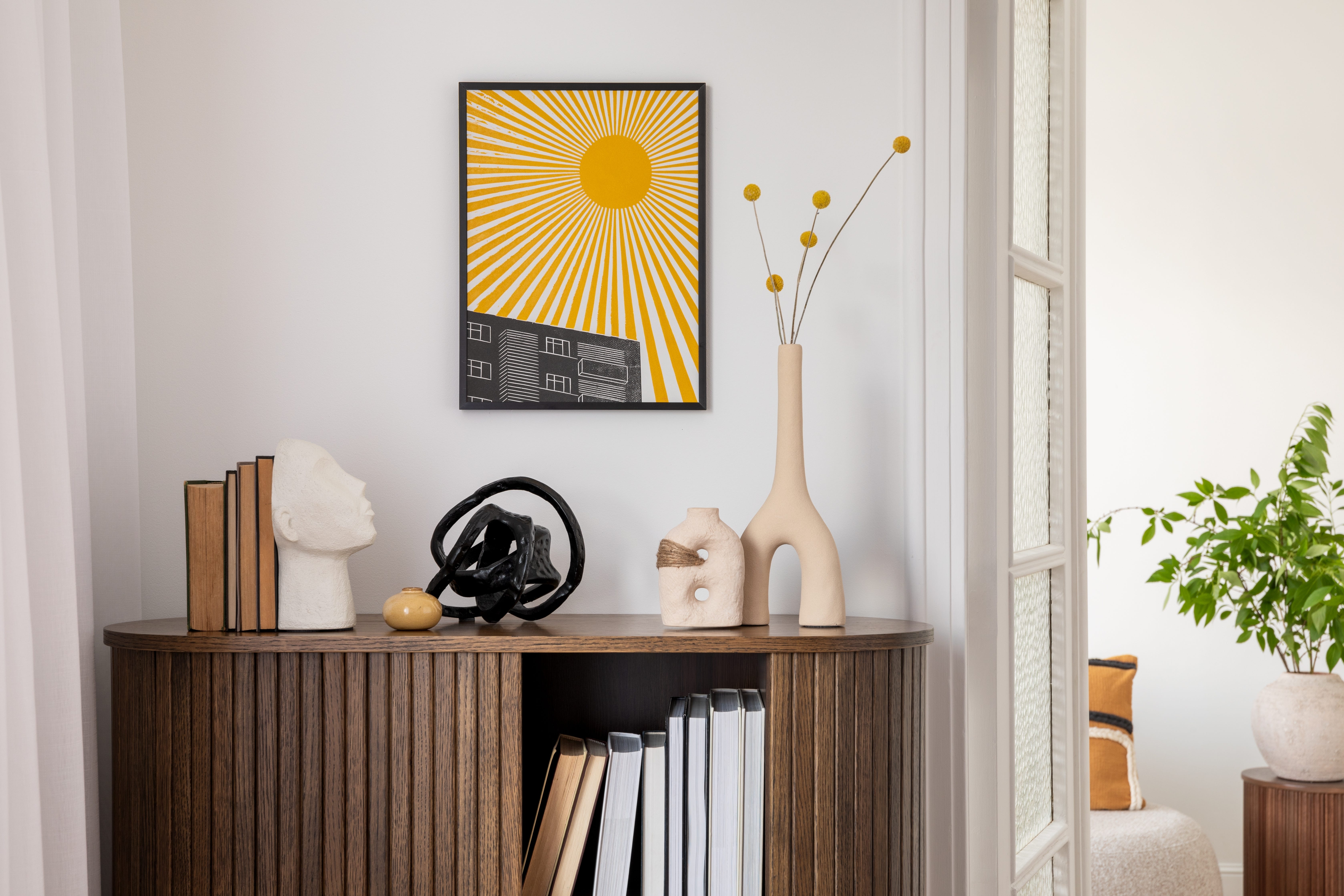A painting hanging on a white wall in someone's home.