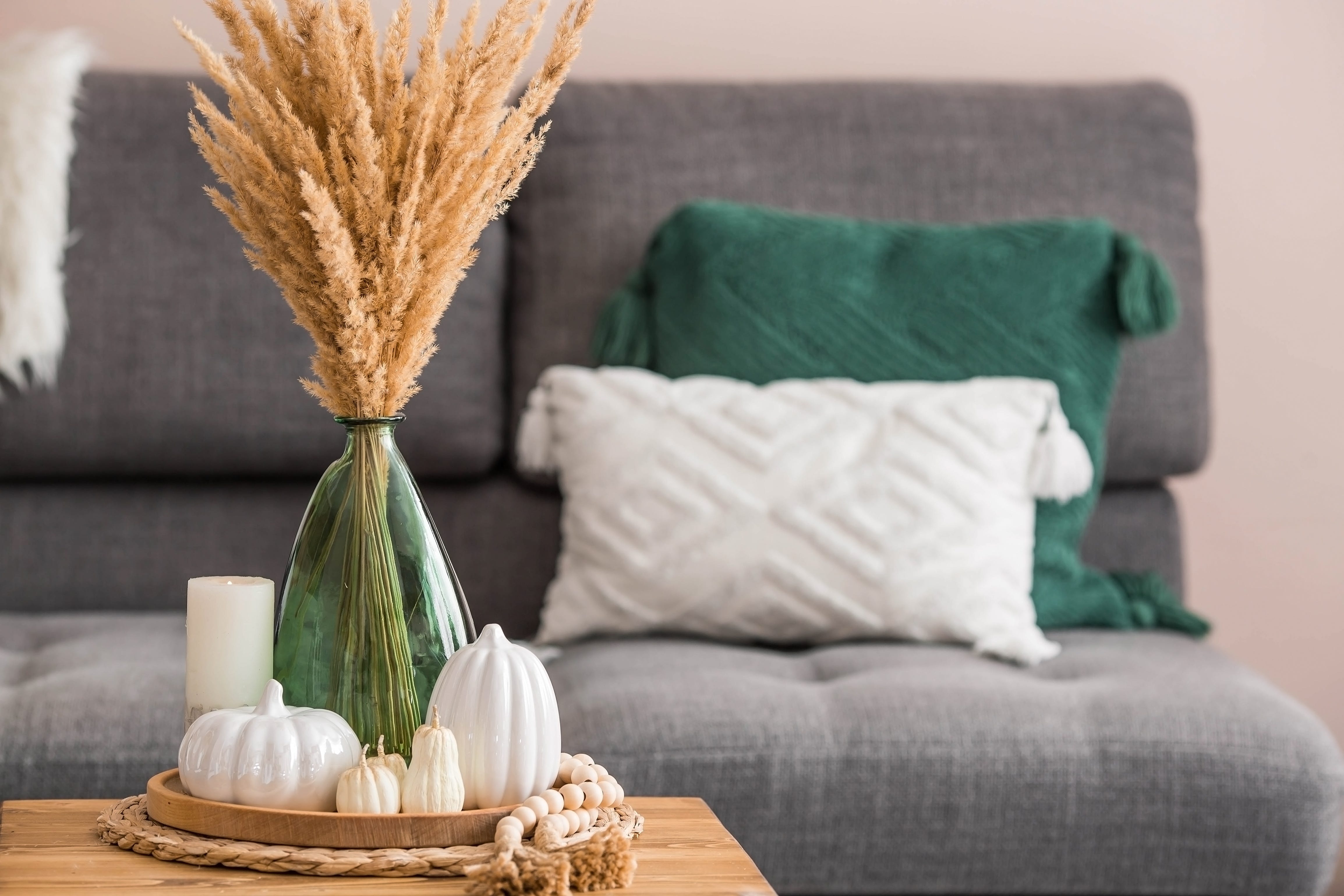 Vase in the forefront of a living room shot.