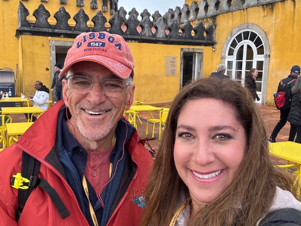 Author Jill Schildhouse smiling with dad in Sintra