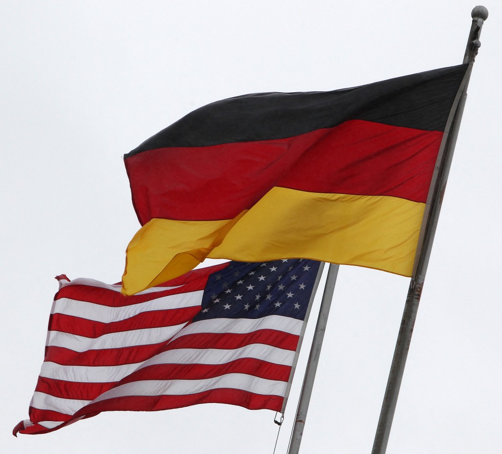 Flags of Germany and the United States flying together.