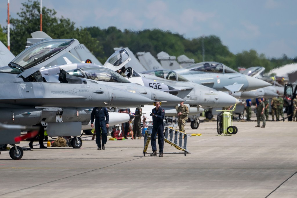 Fighter planes from NATO countries parked on the tarmac at Ramstein Air Base in Germany.