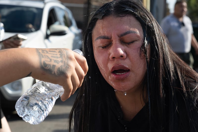 A woman is treated for exposure to tear gas after it was used by federal law enforcement agents