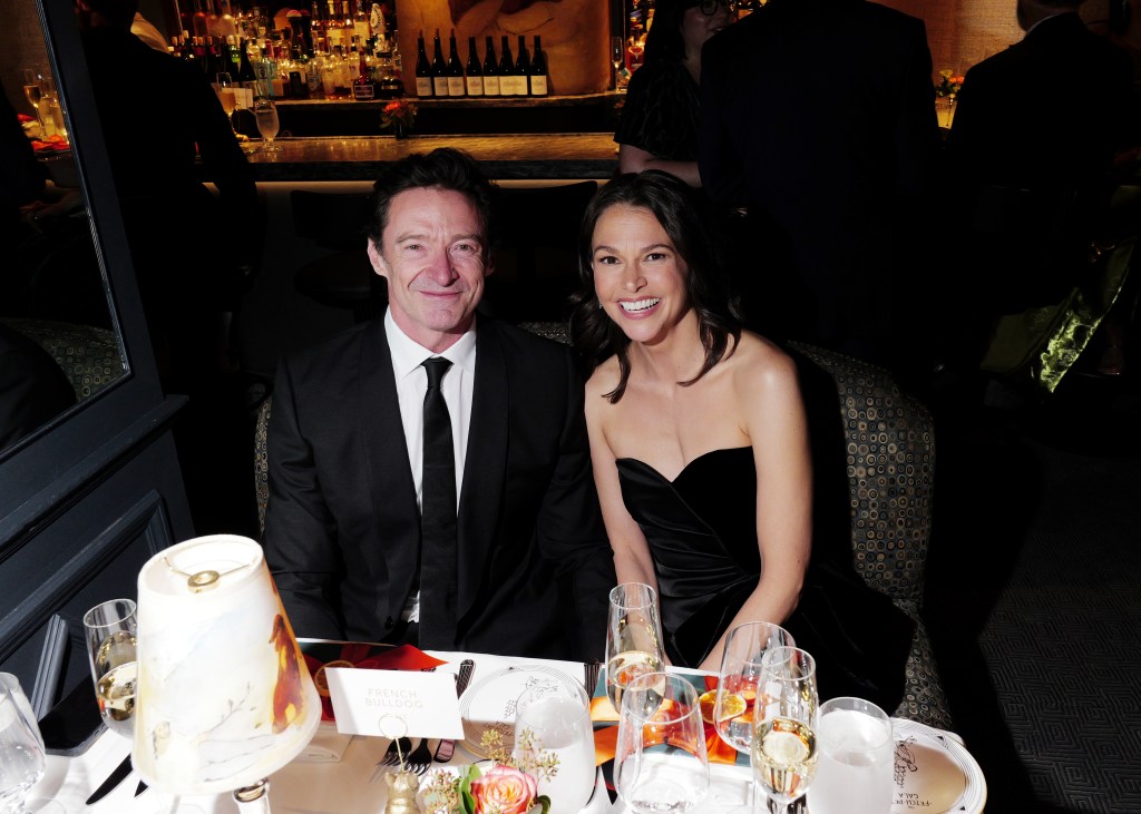 Hugh Jackman and Sutton Foster smiling at the Fetch Pet Gala.