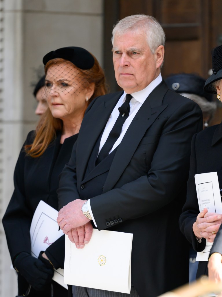Prince Andrew and Sarah Ferguson at the funeral of Katharine, Duchess of Kent. Ferguson is wearing a black cloche hat with netting, and a black coat, Andrew in a black jacket, black waistcoat and grey pants.