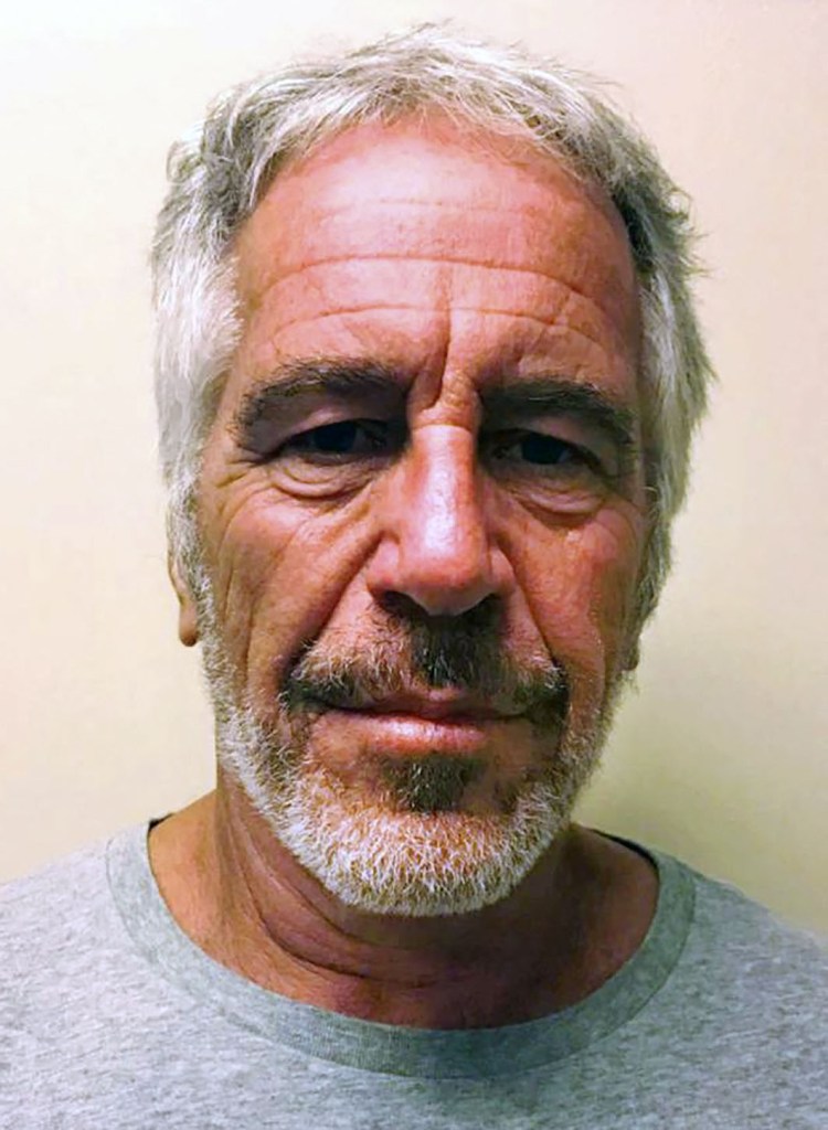 Jeffrey Epstein's mugshot from the New York State Sex Offender Registry. He's wearing a grey t-shirt.